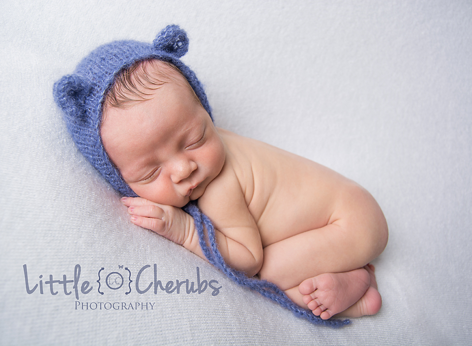 Baby in bear hat newborn boy tushie up pose march ely chatteris huntingdon peterborough
