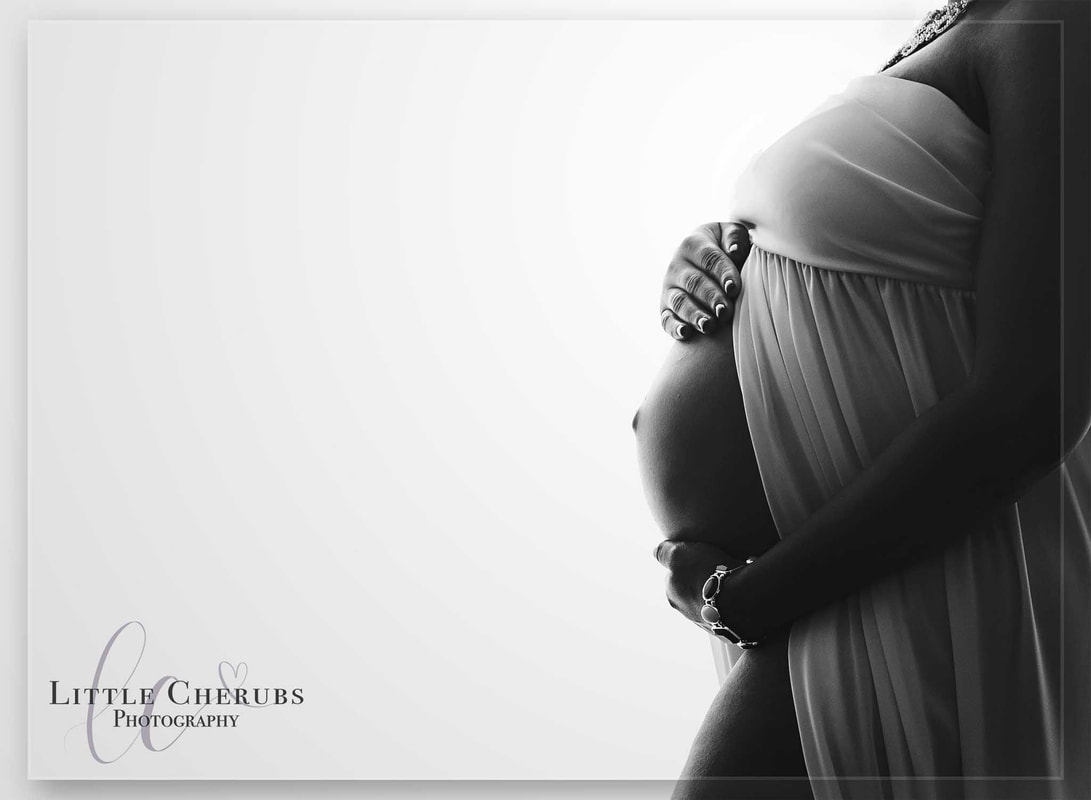 black and white picture of bump and hands close up silhouette pregnancy photos cambridge little cherubs