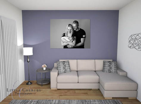 Newborn baby first family portrait hanging on the wall above a sofa black and white photography cambridge little cherubs