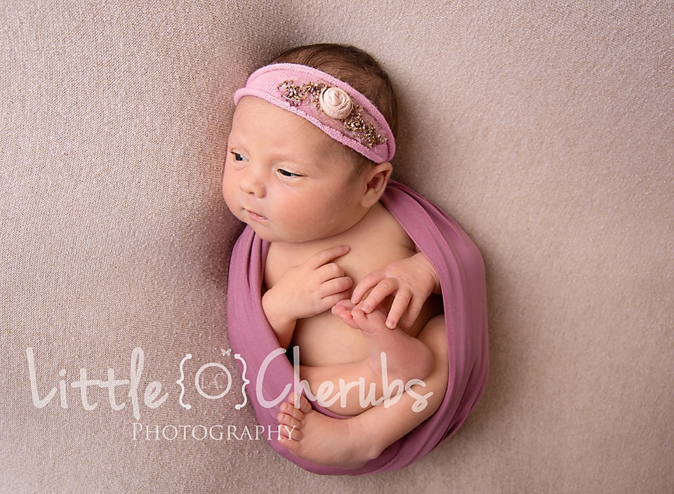 March Peterborough Newborn Photography Studio Baby in pink wrap