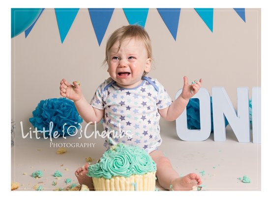baby crying at cake smash and splash photo session march peterborough