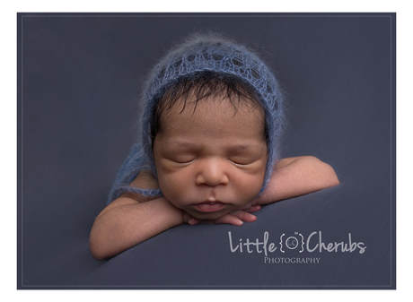 newborn baby on blue cambridge photographer